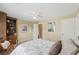 Bright bedroom with dark wooden furniture, neutral tones, and natural light at 6840 N Creekside Pt, Cumming, GA 30041