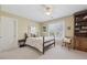 Inviting bedroom with built-in bookshelf, and bright natural light at 6840 N Creekside Pt, Cumming, GA 30041
