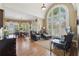 Charming breakfast nook with hardwood floors and large arched window, perfect for casual dining and relaxation at 6840 N Creekside Pt, Cumming, GA 30041