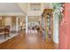 Elegant entryway featuring hardwood floors, a view to the living room, and a grand staircase, creating a welcoming atmosphere at 6840 N Creekside Pt, Cumming, GA 30041