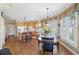 Bright kitchen features hardwood floors, an island, and a breakfast nook, blending functionality with charm at 6840 N Creekside Pt, Cumming, GA 30041