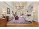 Spacious living room featuring hardwood floors, fireplace, a second story balcony, and views to the dining and entry, offering style at 6840 N Creekside Pt, Cumming, GA 30041