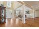 Bright and spacious living room featuring hardwood floors, large windows, and elegant trim, offering a comfortable living space at 6840 N Creekside Pt, Cumming, GA 30041