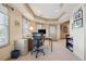 Home office featuring desk, shelves, and a view to the outside; neutral color palette at 6840 N Creekside Pt, Cumming, GA 30041