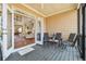 Covered back porch featuring furniture and view of the home's great room at 6840 N Creekside Pt, Cumming, GA 30041