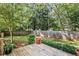 Wooden deck overlooking a well-maintained backyard with mature trees and a wooden fence at 1811 Tilliewood Ne Trl, Marietta, GA 30066