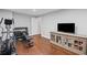 Finished basement area featuring an elliptical machine, free weights, and entertainment center with a large-screen TV at 1811 Tilliewood Ne Trl, Marietta, GA 30066