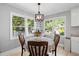 Charming breakfast nook features backyard views, a round table, and overhead lighting at 1811 Tilliewood Ne Trl, Marietta, GA 30066