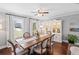 Bright dining room features hardwood floors, and a stylish china cabinet, enhancing the space at 1811 Tilliewood Ne Trl, Marietta, GA 30066