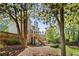 Back of house with large, fenced yard, deck, stairs, and patio at 1811 Tilliewood Ne Trl, Marietta, GA 30066