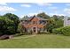 Charming two-story brick home with a well-manicured lawn and a welcoming front entrance at 1811 Tilliewood Ne Trl, Marietta, GA 30066