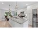 Modern kitchen featuring white cabinets, granite countertops and stainless steel appliances at 1811 Tilliewood Ne Trl, Marietta, GA 30066