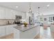 Modern kitchen featuring white cabinets, granite countertops, and stainless steel appliances at 1811 Tilliewood Ne Trl, Marietta, GA 30066
