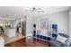 Open-concept living area with a modern kitchen, wood floors, and lots of natural light at 1811 Tilliewood Ne Trl, Marietta, GA 30066