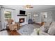Cozy living room featuring a fireplace, hardwood floors and large windows at 1811 Tilliewood Ne Trl, Marietta, GA 30066