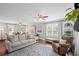Cozy living room features plush seating, natural light, and hardwood floors at 1811 Tilliewood Ne Trl, Marietta, GA 30066