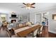 Cozy living room featuring a dining table, hardwood floors, and a ceiling fan at 1811 Tilliewood Ne Trl, Marietta, GA 30066