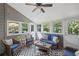 Relaxing sunroom with wicker furniture, outdoor views, and neutral paint at 1811 Tilliewood Ne Trl, Marietta, GA 30066