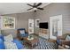 Comfortable sunroom features wicker furniture, ceiling fan, and geometric rug at 1811 Tilliewood Ne Trl, Marietta, GA 30066