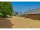 Large backyard with well-maintained lawn and mature trees, perfect for outdoor activities at 5780 Village Loop, Fairburn, GA 30213