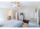 Spacious main bedroom featuring a ceiling fan, dresser, and comfortable bed at 5780 Village Loop, Fairburn, GA 30213