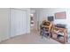Functional office space with desk, closet, and view into dining area at 5780 Village Loop, Fairburn, GA 30213
