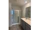 Modern bathroom with glass shower and vanity sink at 184 Grafton St, Hampton, GA 30228