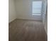 Bright bedroom with neutral carpet and a window offering natural light at 184 Grafton St, Hampton, GA 30228