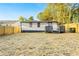 Spacious backyard with a wooden fence, providing privacy and security, and a deck on the house at 358 Roy Sw St, Atlanta, GA 30310