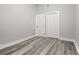 Clean bedroom with wood floors, closet, and bright natural light at 358 Roy Sw St, Atlanta, GA 30310