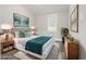 Bright bedroom featuring a queen-sized bed, bedside tables, and modern decor at 358 Roy Sw St, Atlanta, GA 30310