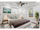 Staged bedroom featuring modern decor, natural light, and ceiling fan at 358 Roy Sw St, Atlanta, GA 30310