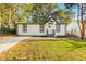 Beautifully renovated house exterior featuring a freshly manicured lawn at 358 Roy Sw St, Atlanta, GA 30310