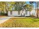 Charming home featuring a well-maintained lawn, modern exterior, and inviting entrance at 358 Roy Sw St, Atlanta, GA 30310