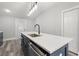 New kitchen with island, stainless appliances, modern fixtures, and white countertops and ample storage at 358 Roy Sw St, Atlanta, GA 30310