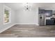 Open-concept living and dining area with lots of natural light at 358 Roy Sw St, Atlanta, GA 30310