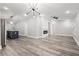 Open concept living area with luxury vinyl floors and modern lighting at 358 Roy Sw St, Atlanta, GA 30310