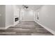 Open-concept living area with hardwood flooring, fireplace, and neutral color palette at 358 Roy Sw St, Atlanta, GA 30310
