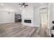 Open-concept living space with modern fireplace, hardwood floors, and ample natural light at 358 Roy Sw St, Atlanta, GA 30310