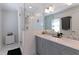Modern bathroom featuring double vanity with marble countertop and glass-enclosed shower at 3811 Valley Green Dr, Marietta, GA 30068