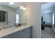 Bright bathroom boasts double vanity and view to a bedroom at 3811 Valley Green Dr, Marietta, GA 30068