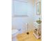 Well-lit half bathroom features modern fixtures, a white vanity, and minimalist decor at 3811 Valley Green Dr, Marietta, GA 30068