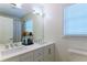 Light-filled bathroom with a double vanity and a shower with stylish curtains at 3811 Valley Green Dr, Marietta, GA 30068
