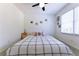 Bright bedroom with ceiling fan, large window, and neutral tones, offering a calm atmosphere at 3811 Valley Green Dr, Marietta, GA 30068