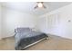 Bright bedroom offers a plush bed, ceiling fan and double closets at 3811 Valley Green Dr, Marietta, GA 30068