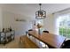 Inviting dining room with hardwood floors, modern light fixture, and a bar cart for elevated entertaining at 3811 Valley Green Dr, Marietta, GA 30068