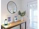 Inviting entryway with console table, framed prints, and a round mirror at 3811 Valley Green Dr, Marietta, GA 30068