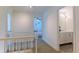 Second floor hallway leads to a bedroom and bathroom with carpet flooring at 3811 Valley Green Dr, Marietta, GA 30068