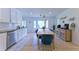Bright kitchen boasts a bay window, white cabinets, stainless-steel appliances, and a wooden table at 3811 Valley Green Dr, Marietta, GA 30068