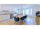 This eat-in kitchen features modern white cabinets, a large bay window, and stainless-steel appliances at 3811 Valley Green Dr, Marietta, GA 30068
